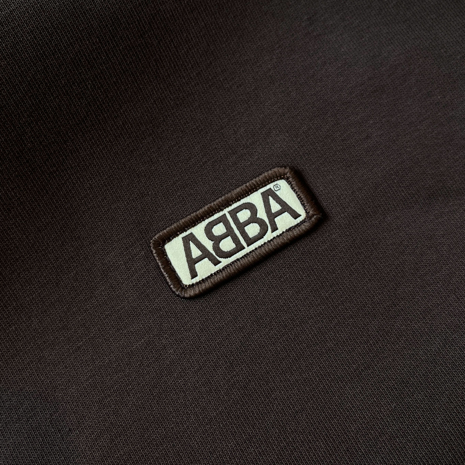 https://images.bravado.de/prod/product-assets/product-asset-data/abba/abba/products/509343/web/488937/image-thumb__488937__3000x3000_original/ABBA_ABBA-Patch-Hoodie-Brown_Hoodie_s509343_o5085749_a488937_v12306303.fb02ee05.png